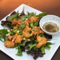 Lemon Pepper · Lightly battered and tossed with jalapenos and garlic, served on a bed of spring mix and a s...
