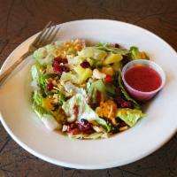 Caribbean Salad · With cashews, pineapple, sun-dried tomatoes, cranberries and walnuts with raspberry vinaigre...