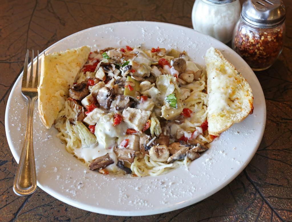 Mogio's Signature Chicken · Roasted chicken, artichoke hearts, sun-dried tomatoes and mushrooms tossed in Alfredo sauce and served over fettuccine noodles with cheese bread.