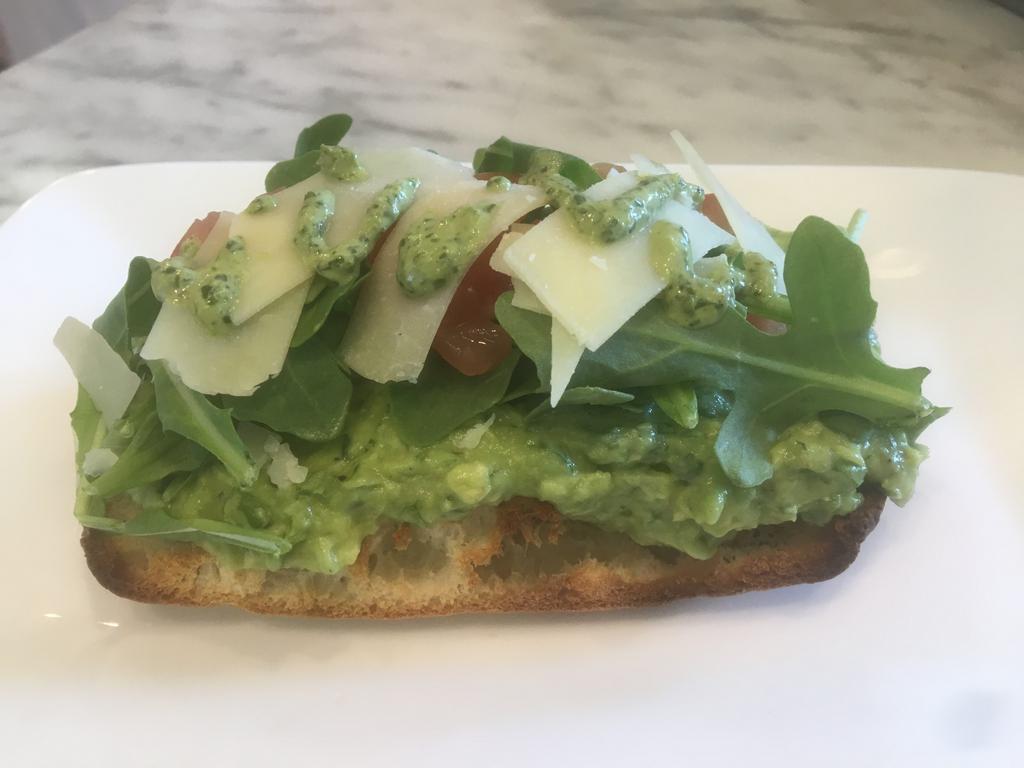 Avocado Bruschette · Toasted Tonino's bread topped with avocado, arugula, chopped tomato and shaved parmesan