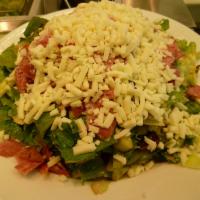 Chopped Anti Pasta Salad · Chopped organic baby greens, romaine, Genoa salami, mozzarella, cannellini beans, tomato, ba...