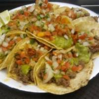4 Carne Asada Street Tacos · Guacamole and pico.
