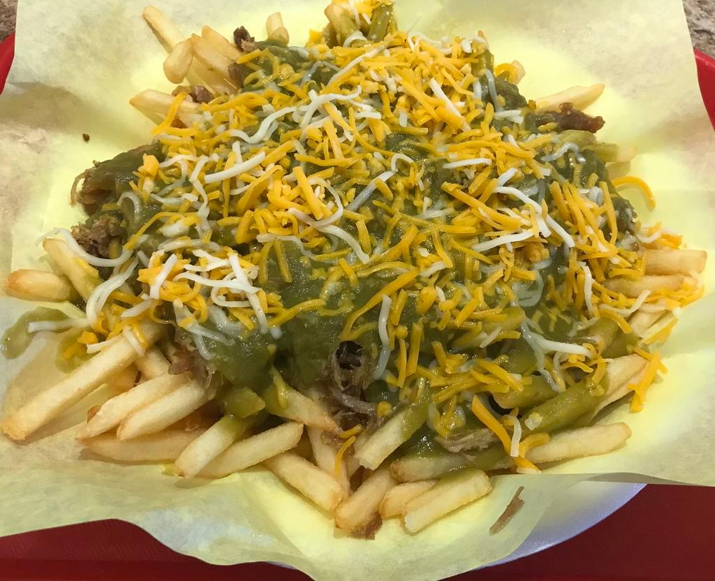 Chile Verde Fries with Cheese · fries topped with carnitas and spicy green sauce and cheese