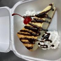 Cheesecake · New York Cheesecake drizzled with chocolate, whipped cream & cherry