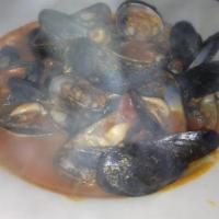 Cozze e Vongole · Clams, mussels sauteed in a white wine, tomato and garlic broth.