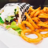 Gyros Pita · A unique blend of lamb and beef seasoned and broiled stuffed in a pita with tzatziki sauce, ...