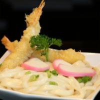 Shrimp Tempura Udon · Japanese noodle soup.  Served with fish cake and vegetables.