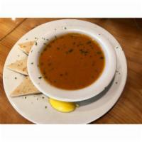 Large Tomato Soup · Smooth soup with pureed tomatoes and seasoning.