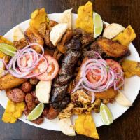Picada Colombiana Grande (10 - 12 personas) · Beef, chicken, pork crackling (chicharron), Colombian sausage (chorizo), morcilla, sweet pla...