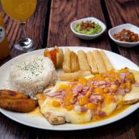 Pechuga a la Hawaiana · Grilled juicy chicken breast topped with melted cheese, ham and pineapple sauce.