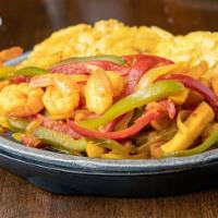 Camarones Salteados · Shrimp mixed with bell peppers, onions and french fries, sauteed in sweet tomato sauce.