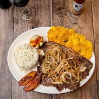 Bistec Encebollado · Grilled steak with sauteed onions.
