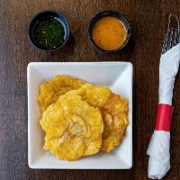 Tostones · Smashed green plantain.