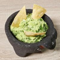 Guacamole con Chips · Guacamole with chips. Comes with onions, cilantro, salt, and lemon.