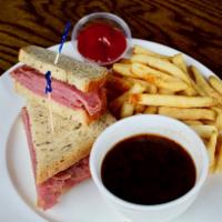 Kelly's Corned Beef Sandwich · Au jus and served on toasted rye bread.