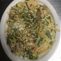 Chicken and Shrimp Pasta with Garlic Toast · Grilled chicken and shrimp over fettuccine noodles tossed in creamy Alfredo Parmesan sauce o...
