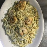 Shrimp Alfredo with Garlic Toast · Grilled shrimp served on a bed of fettuccine with creamy Alfredo sauce or sweet basil wine s...