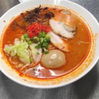 Red Tonkotsu Ramen · Creamy spicy pork bone broth, topped with chashu pork, soft boiled egg, cabbage, wood ear mu...