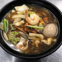 Gomoku Ramen · Soy sauce based chicken broth, topped with a starched sauce consisting of shrimp, chicken, a...