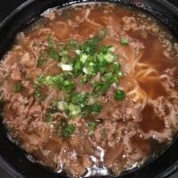 Niku Ramen · Soy sauce based chicken broth, topped with thinly sliced beef and onions.