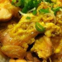 Oyako Don  · Bowl of rice topped with pieces of chicken, beaten egg, and slices of onions cooked in house...