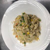 Chicken Fried Rice · Stir-fried rice with pieces of chicken, carrot, peas, and green onions.