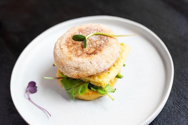 E Classic · Beyond Breakfast Sausage, Just Egg, Vegan Smoked Gouda  Cheese on an English Muffin.