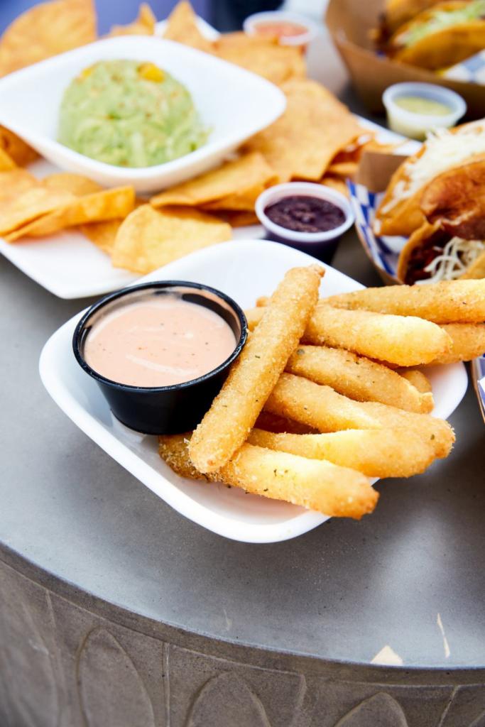 Breaded Yuca Fries · Yuca is a root vegetable similar to a potato. Yuca fries are breaded on the outside with a light baked potato like filling. (Contains egg) Served with house made mayo ketchup sauce.