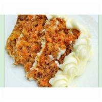 Carrot Cake · Dark, fruity and moist with walnuts, raisins and cream cheese frosting.