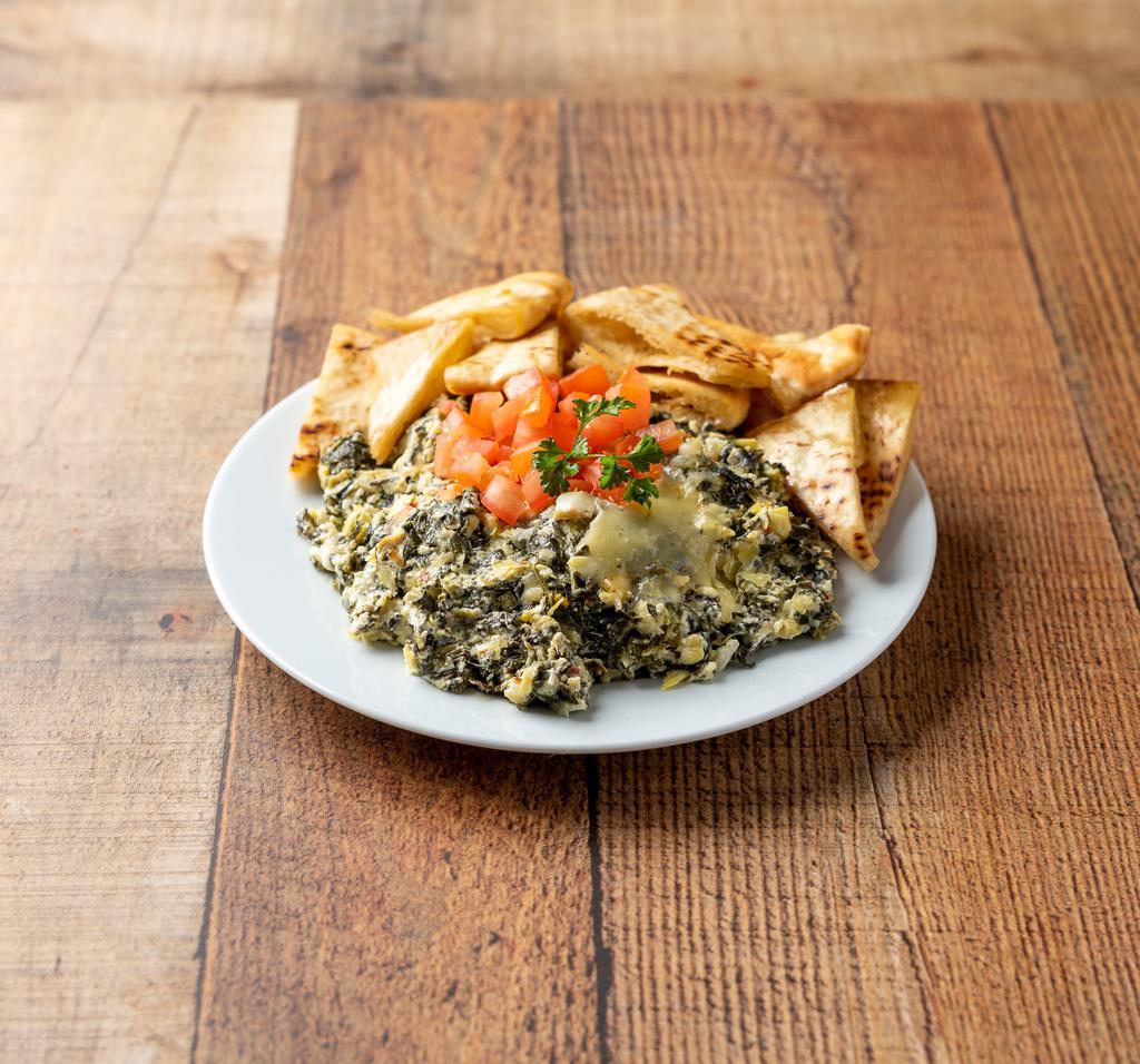 Spinach and Artichoke Dip · Served with pita chips and sour cream.