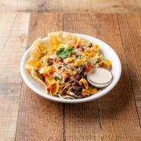 Veggie Taco Salad · Lettuce, fritos, fiesta beans, tomatoes and jack and cheddar cheese. Add proteins for an add...
