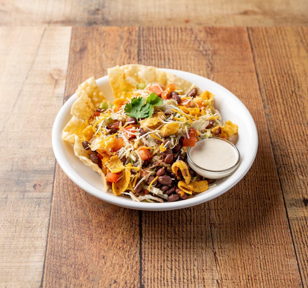 Veggie Taco Salad · Lettuce, fritos, fiesta beans, tomatoes and jack and cheddar cheese. Add proteins for an additional charge.