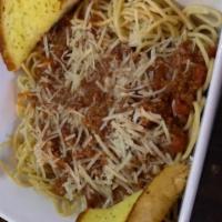 Mamas Spaghetti · Bolognese sauce with fresh mushrooms served on a bed of spaghetti noodles with garlic bread.