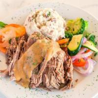 Angus Pot Roast · Chef's famous braised beef, slow cooked until fork tender. Served with mashed potatoes and s...