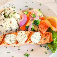 Wild Alaskan Salmon · Grilled wild Alaskan salmon and topped with tarragon herb butter. Served with choice of wild...