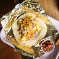 Bean & Egg Taco · refried beans w/ cheddar, onion & scrambled egg, served on housemade flour tortilla. Served ...