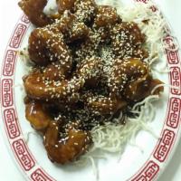 H9. Sesame Crispy Shrimp · Shrimp lightly fried to crispy, with a spicy, semi-sweet and sour garlic sauce then topped w...