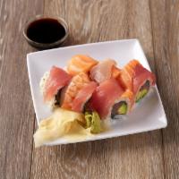 Rainbow Roll · Tuna and avocado on the inside. Tuna, yellowtail, salmon and shrimp on top*