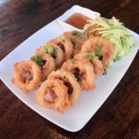 Calamari · Lightly battered and fried calamari, served with Thai sweet and sour sauce.