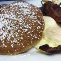 Pancakes · Four silver dollar pancakes. Served with two eggs any style and your choice of ham, bacon or...