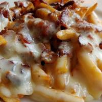 Disco Fries · Our famous French fries smothered with brown gravy and shredded cheddar cheese. Add bacon fo...