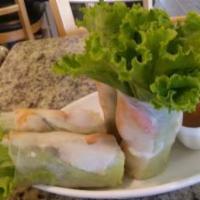1A. Salad Rolls · (Orders of 4) Goi cuon. Rice paper rolls with shrimp, pork, rice noodles, bean sprouts, lett...