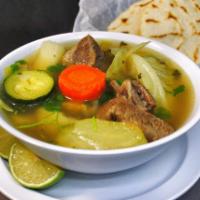 Beef soup (sopa res) · Beef soup with vegetables, rice and two hand made tortillas