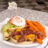 Bacon & Cheddar Melburger · Draped with cheddar cheese, two strips of bacon, lettuce, tomato, and onion, with Thousand i...
