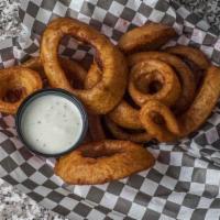 Beer Battered Onion Rings · Sweet Spanish onions thick-cut, double dipped in beer batter and fried crispy.