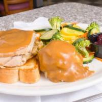 Fresh Oven Roasted Turkey · Sliced oven roasted turkey with dressing and cranberry sauce.