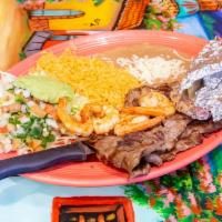 Carne Asada con Camarones · Roasted steak and shrimp, served with rice, beans and salad.