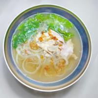 N1. Chicken PHO Noodle Soup · rice noodles, sliced chickens, green leaves and bean sprout in a clear broth top sliced onio...