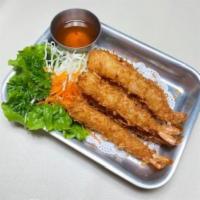 8.Coconut Shrimps · 6 shrimps deep fried in coconut breading. Served with sweet-sour sauce.