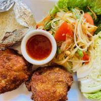 S- 10 Som Tum Picnic · Plates with papaya salad , crispy Thai style fried chickens, sticky rice and sweet and sour ...